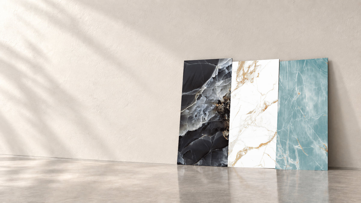 Three upright 24 × 48 tiles against a quiet plaster wall